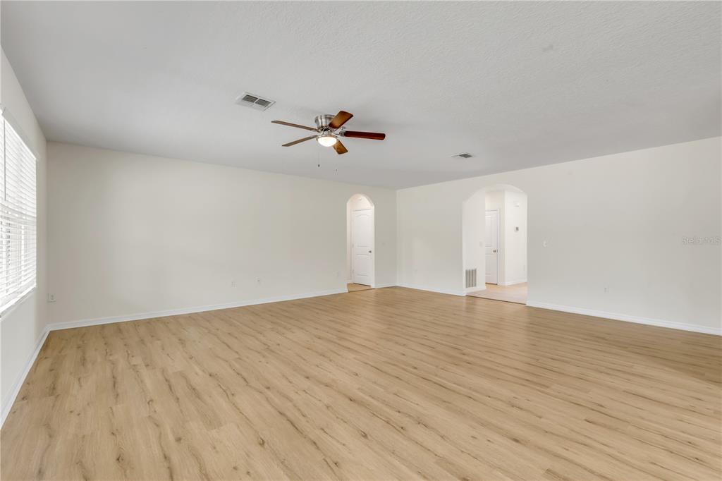 48 Hickory Loop Ocala, FL 34472 - Photo 22 of 52 a view of empty room with wooden floor and fan