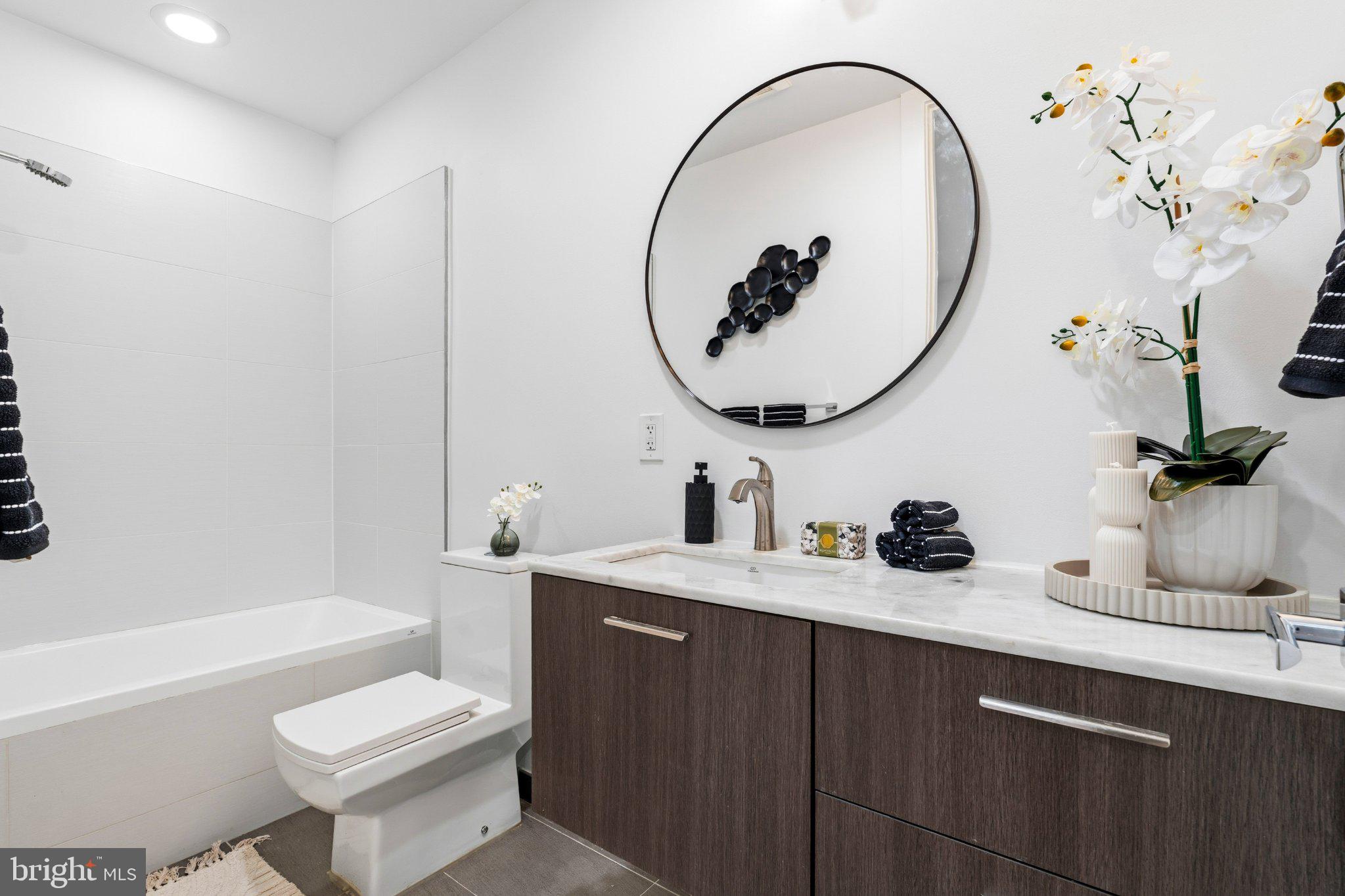 1837 Kalorama Road Northwest, Unit F Washington, DC 20009 - Photo 17 of 42 Sleek modern bathroom with elegant touches.