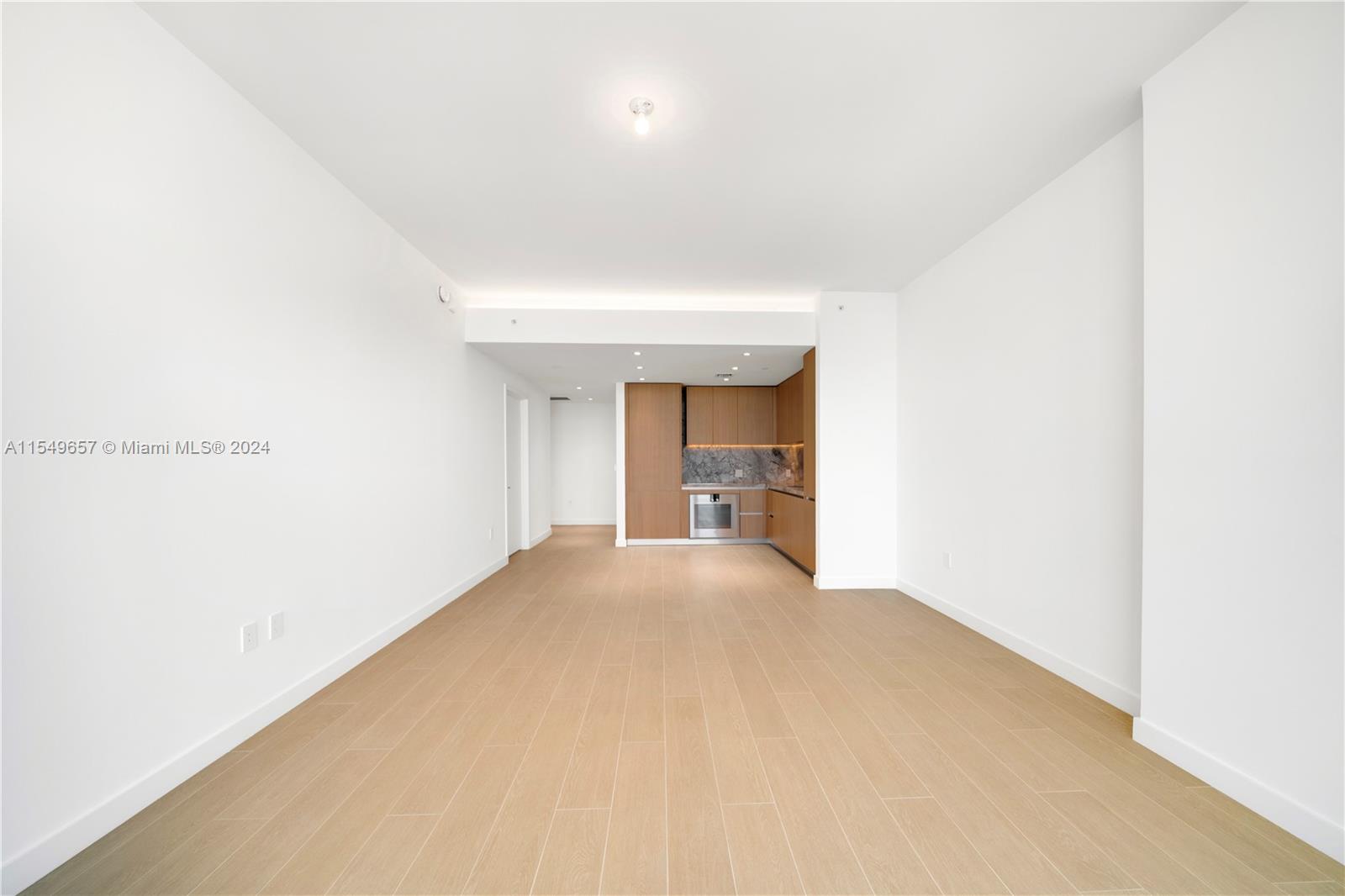 500 Alton Road, Unit 1806 Miami Beach, FL 33139 - Photo 7 of 8 a view of empty room with wooden floor