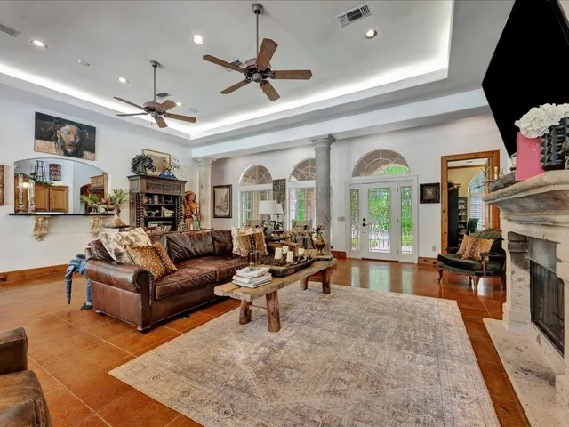 a living room with furniture and a fireplace