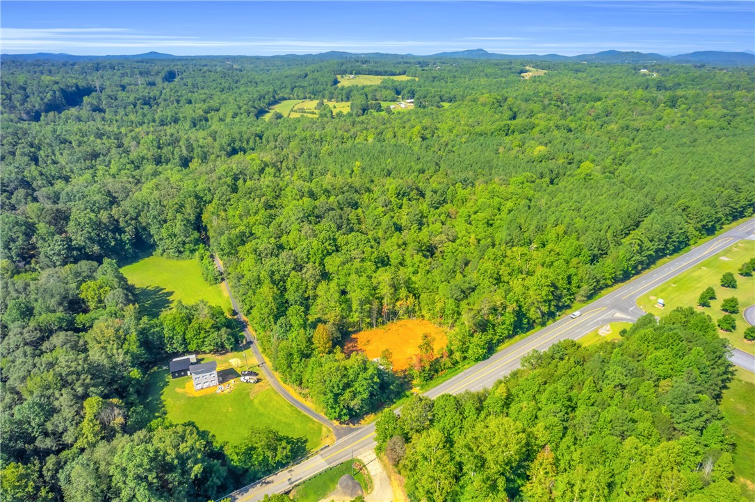 167 Cherokee Trail Easley, SC 29640 - Photo 15 of 18 Panoramic aerial views showcase verdant woodlands and rolling hills, offering a serene, private setting for your future home.