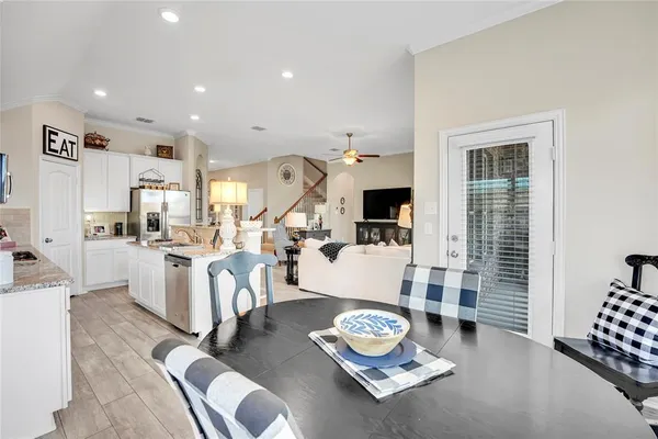 a living room with furniture and flat screen tv