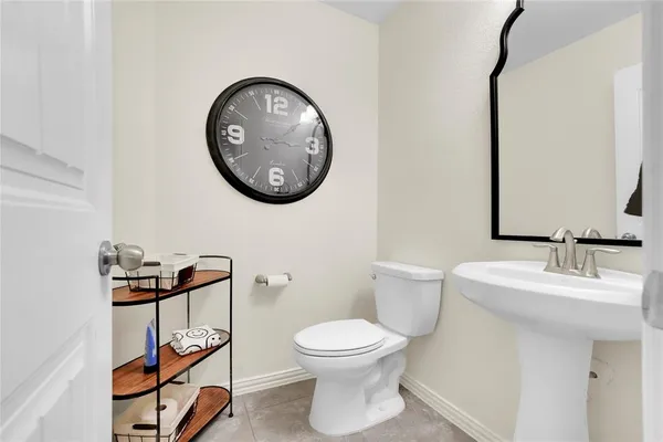 a bathroom with a toilet and a sink