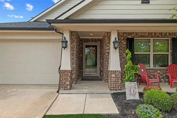 a front view of a house with a porch