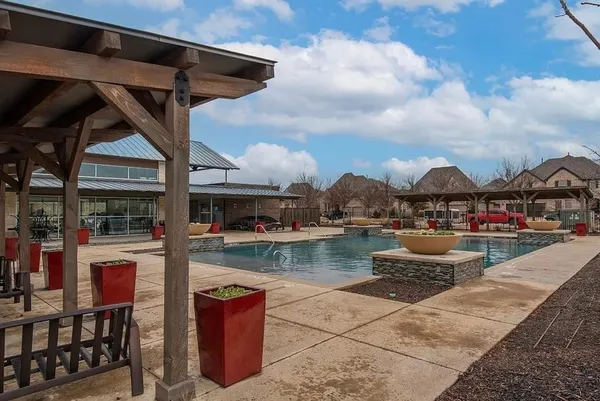 a view of swimming pool with outdoor seating