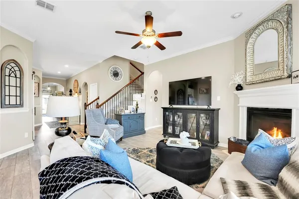 a living room with furniture fireplace and flat screen tv