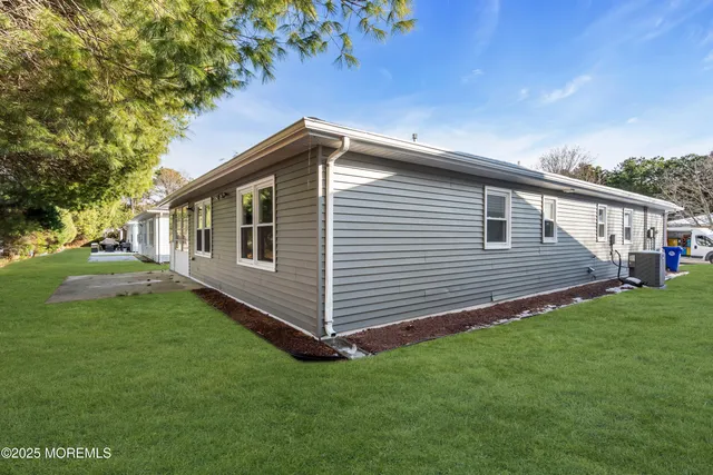 a view of a house with a backyard