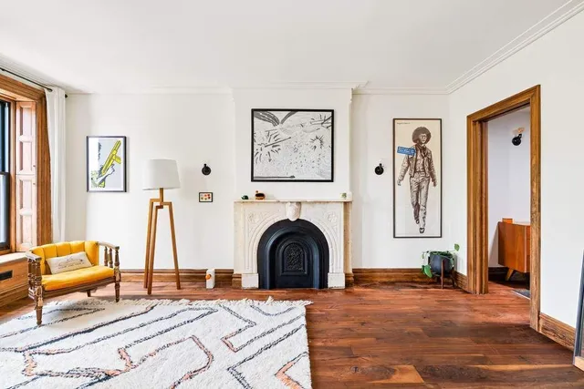 a bedroom with a bed and a fireplace