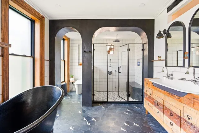 a living room with two chairs and a large window