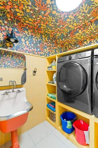 a bathroom with a sink mirror and vanity