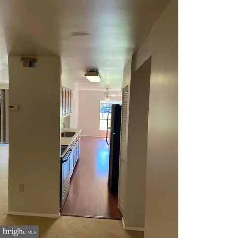 a view of a living room with bathroom