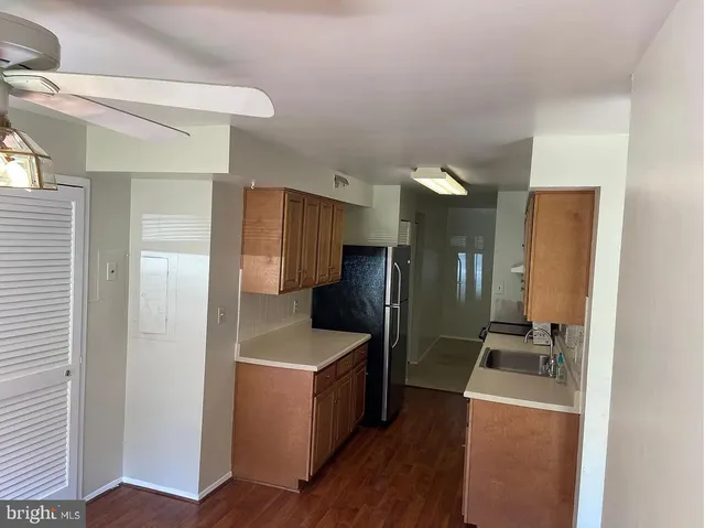 a kitchen with a refrigerator sink and stove