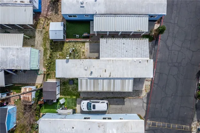 an aerial view of a house with a garden