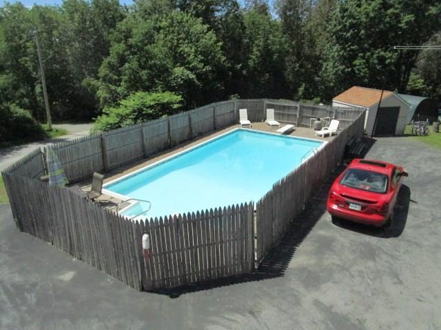511 Dow Road Orrington, ME 04474 - Photo 23 of 28 VIEW OF THE IN-GROUND POOL FROM THE...