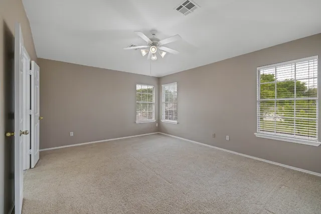 a view of an empty room with a window