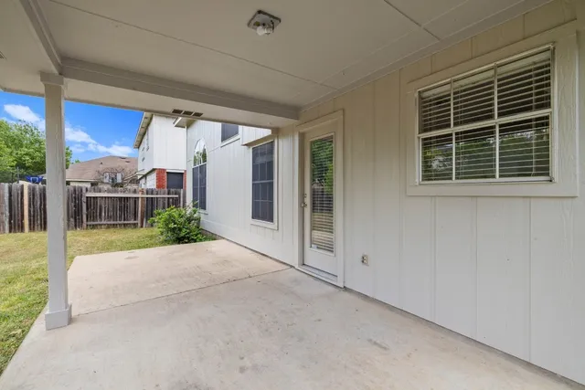 a view of backyard with porch