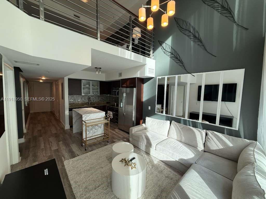 41 Southeast 5th Street, Unit 708 Miami, FL 33131 - Photo 1 of 29 a living room with furniture