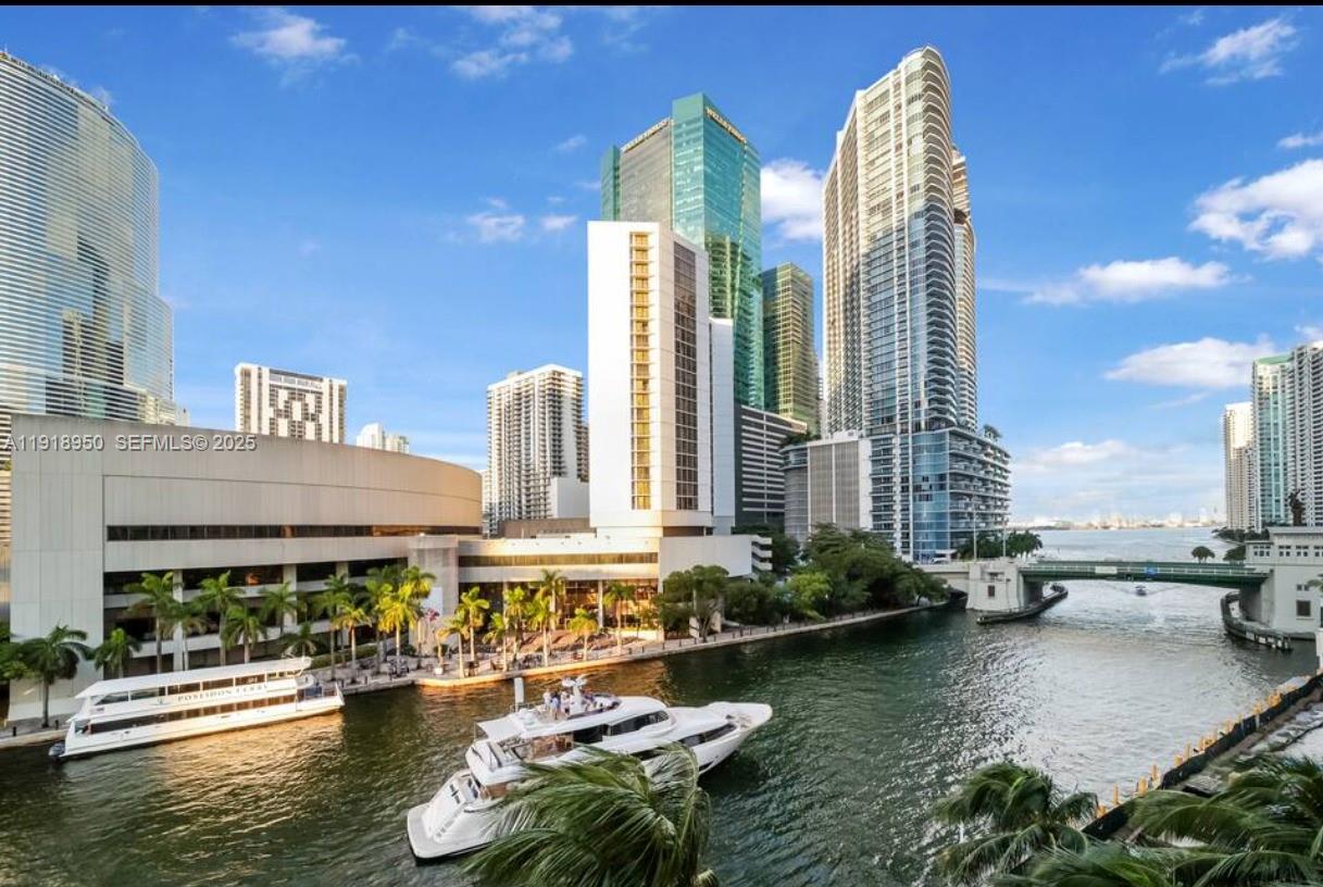 41 Southeast 5th Street, Unit 708 Miami, FL 33131 - Photo 26 of 29 a view of a lake with tall buildings