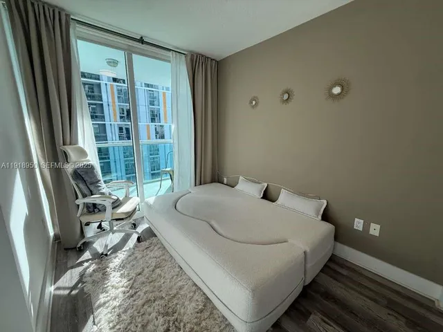 a spacious bathroom with a tub and shower