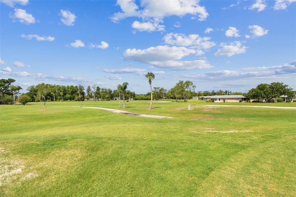 3745 Teeside Drive, Unit 3745 New Port Richey, FL 34655 - Photo 23 of 34 a view of a big room with lots of green space