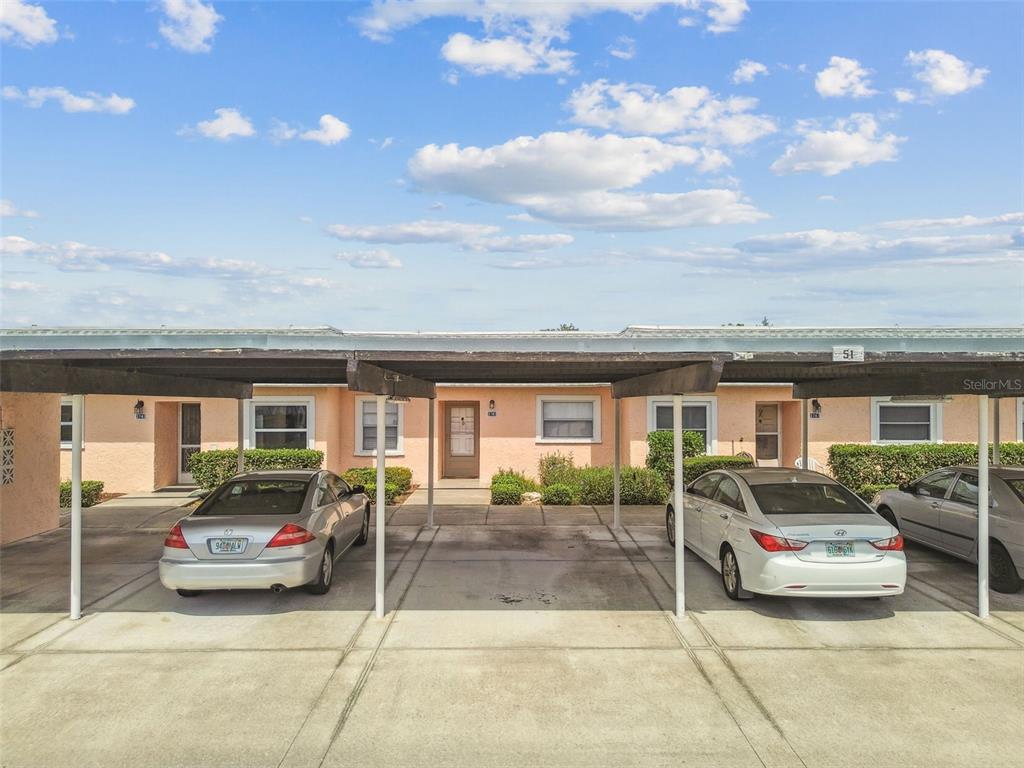 3745 Teeside Drive, Unit 3745 New Port Richey, FL 34655 - Photo 25 of 34 a view of a car parked in front of a building