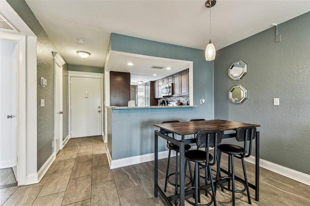 3745 Teeside Drive, Unit 3745 New Port Richey, FL 34655 - Photo 4 of 34 a view of a dining room with furniture and chandelier