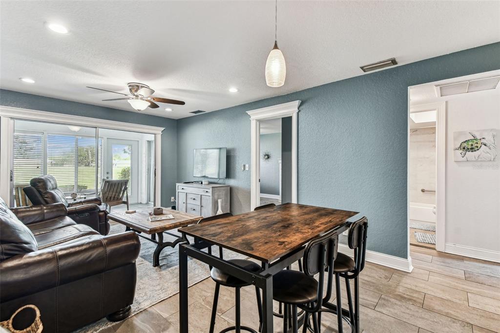 3745 Teeside Drive, Unit 3745 New Port Richey, FL 34655 - Photo 5 of 34 a view of a dining room with furniture and wooden floor