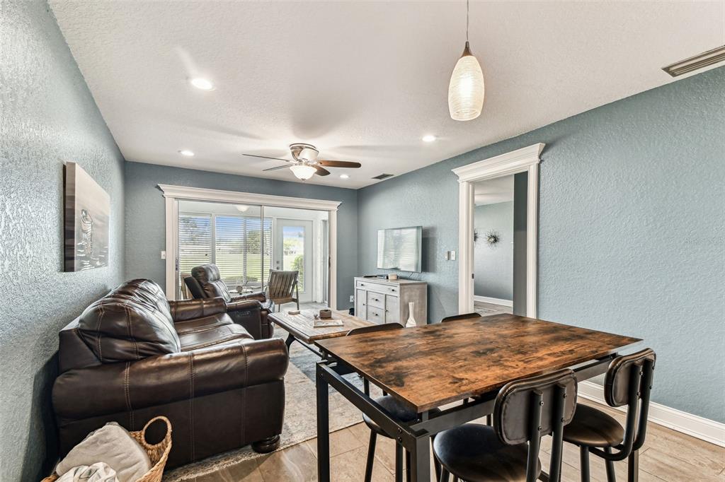 3745 Teeside Drive, Unit 3745 New Port Richey, FL 34655 - Photo 6 of 34 a living room with furniture and large windows