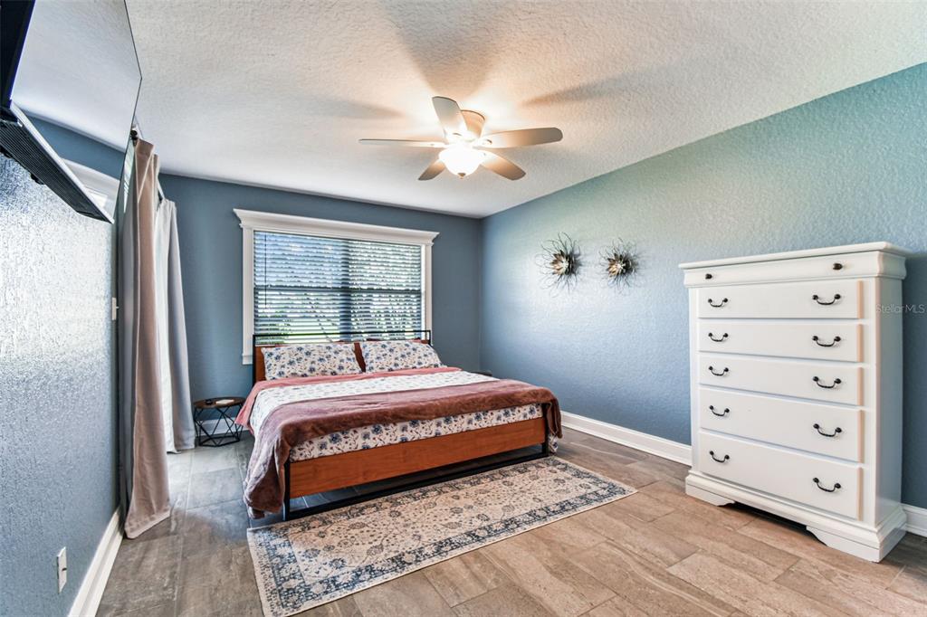 3745 Teeside Drive, Unit 3745 New Port Richey, FL 34655 - Photo 10 of 34 a bedroom with a bed and a window