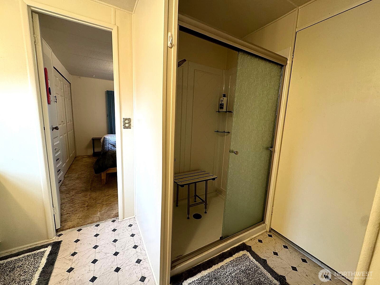 2210 Old Highway 99 South Road, Unit 31 Mount Vernon, WA 98273 - Photo 13 of 23 a bathroom with a glass door shower and a sink