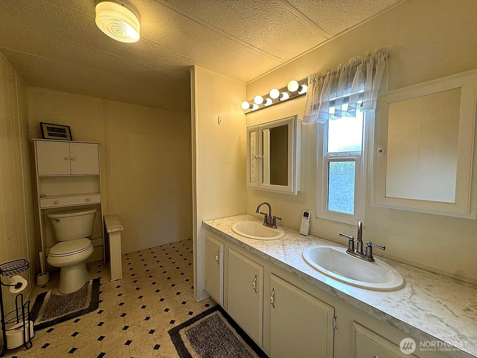 2210 Old Highway 99 South Road, Unit 31 Mount Vernon, WA 98273 - Photo 15 of 23 a bathroom with a sink mirror vanity and toilet