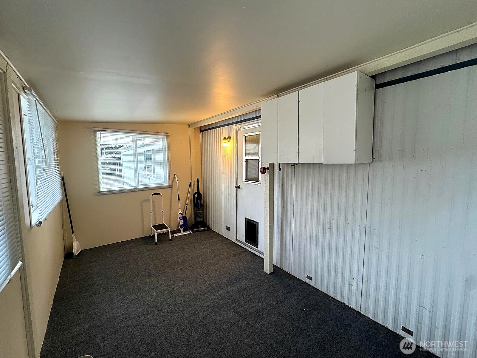 2210 Old Highway 99 South Road, Unit 31 Mount Vernon, WA 98273 - Photo 16 of 23 a view of a kitchen with wooden floor and a window