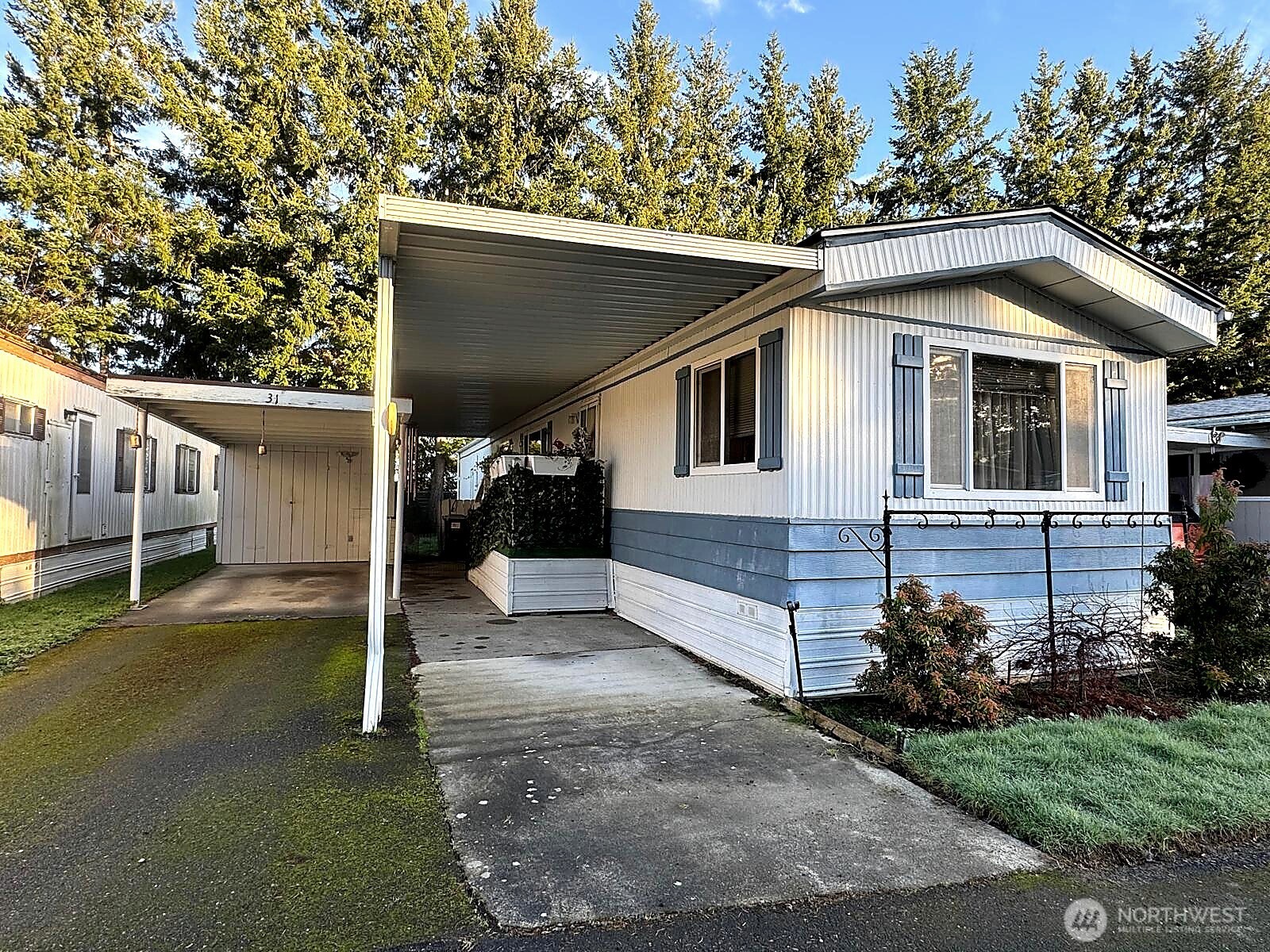 2210 Old Highway 99 South Road, Unit 31 Mount Vernon, WA 98273 - Photo 2 of 23 a front view of a house with a yard