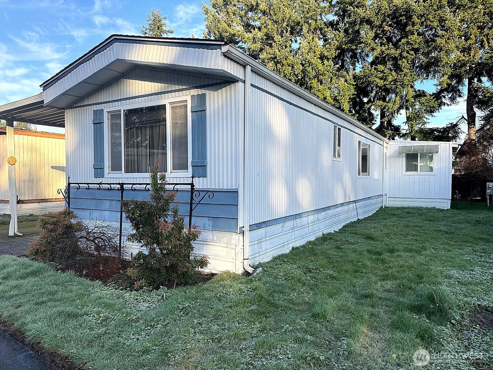 2210 Old Highway 99 South Road, Unit 31 Mount Vernon, WA 98273 - Photo 3 of 23 a front view of house with yard and outdoor seating