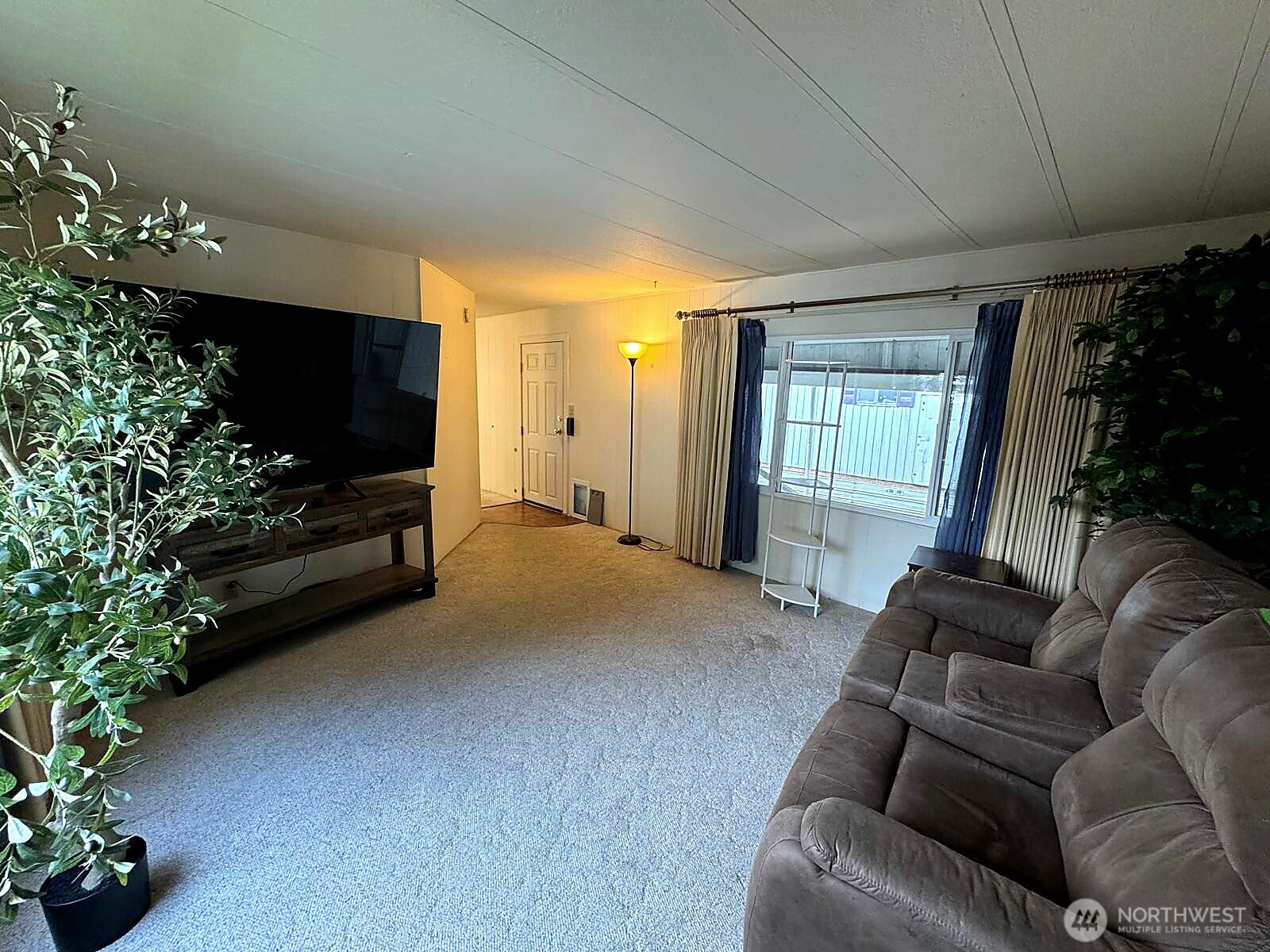 2210 Old Highway 99 South Road, Unit 31 Mount Vernon, WA 98273 - Photo 7 of 23 a living room with furniture potted plant and a window