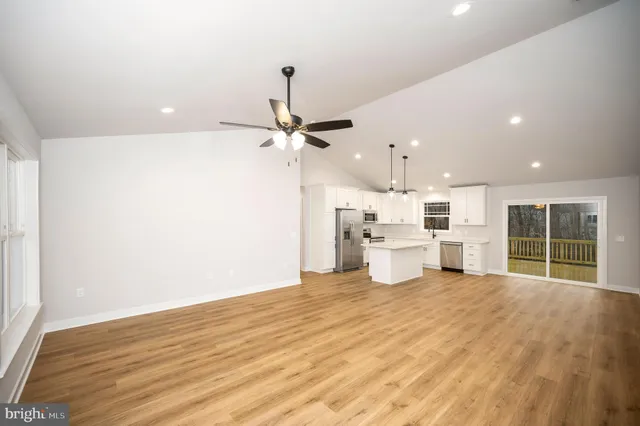 a view of a kitchen with a sink and a window