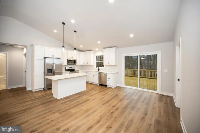 a view of kitchen with wooden floor