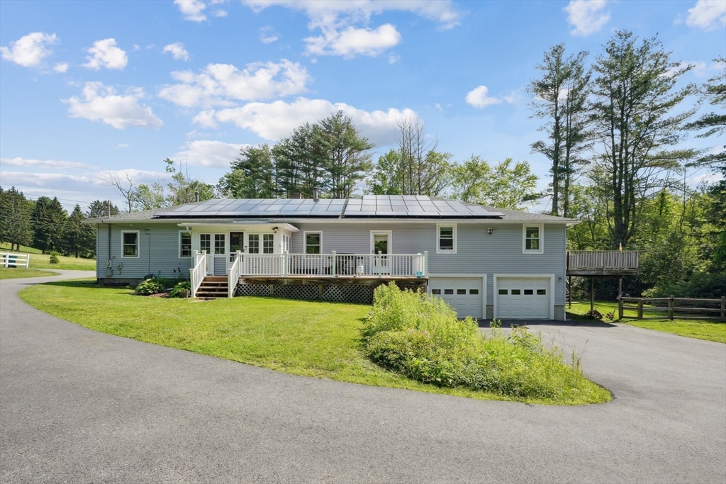 156 Langen Road Lancaster, MA 01523 - Photo 1 of 26 a front view of house with yard and green space