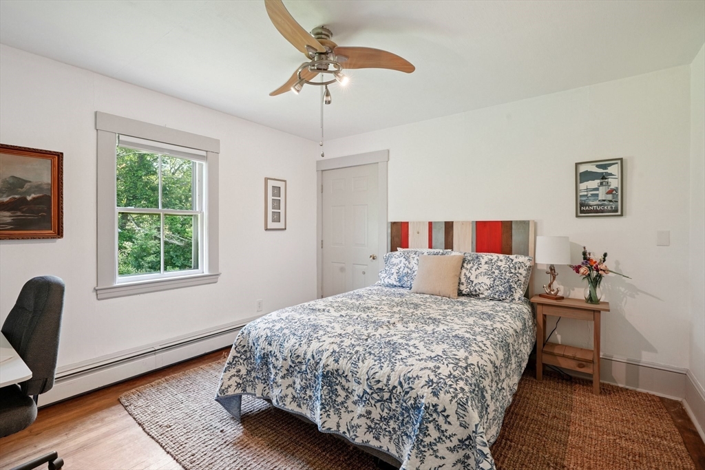 156 Langen Road Lancaster, MA 01523 - Photo 17 of 26 a bedroom with a bed and a window