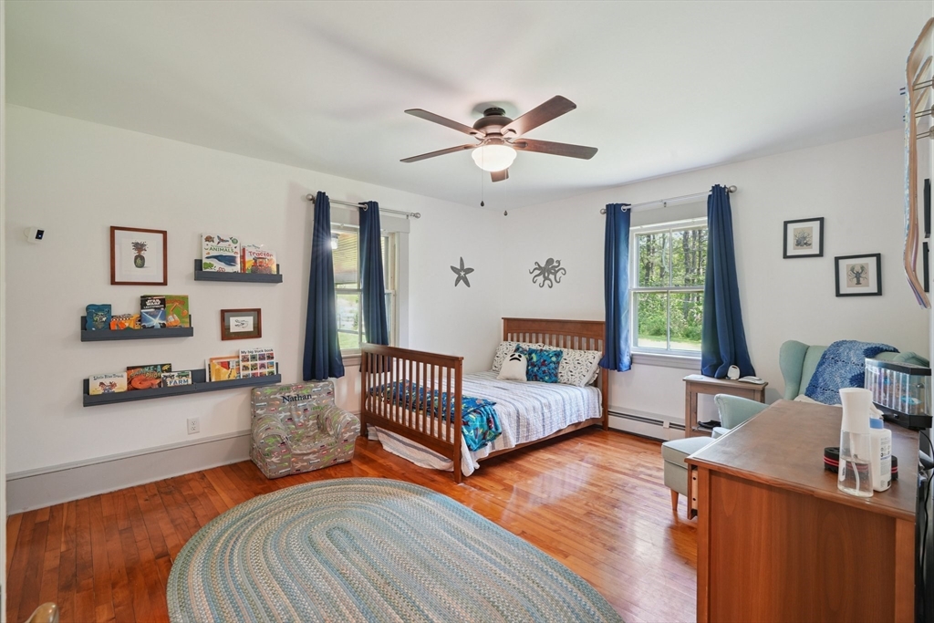 156 Langen Road Lancaster, MA 01523 - Photo 18 of 26 a bedroom with a bed and wooden floor