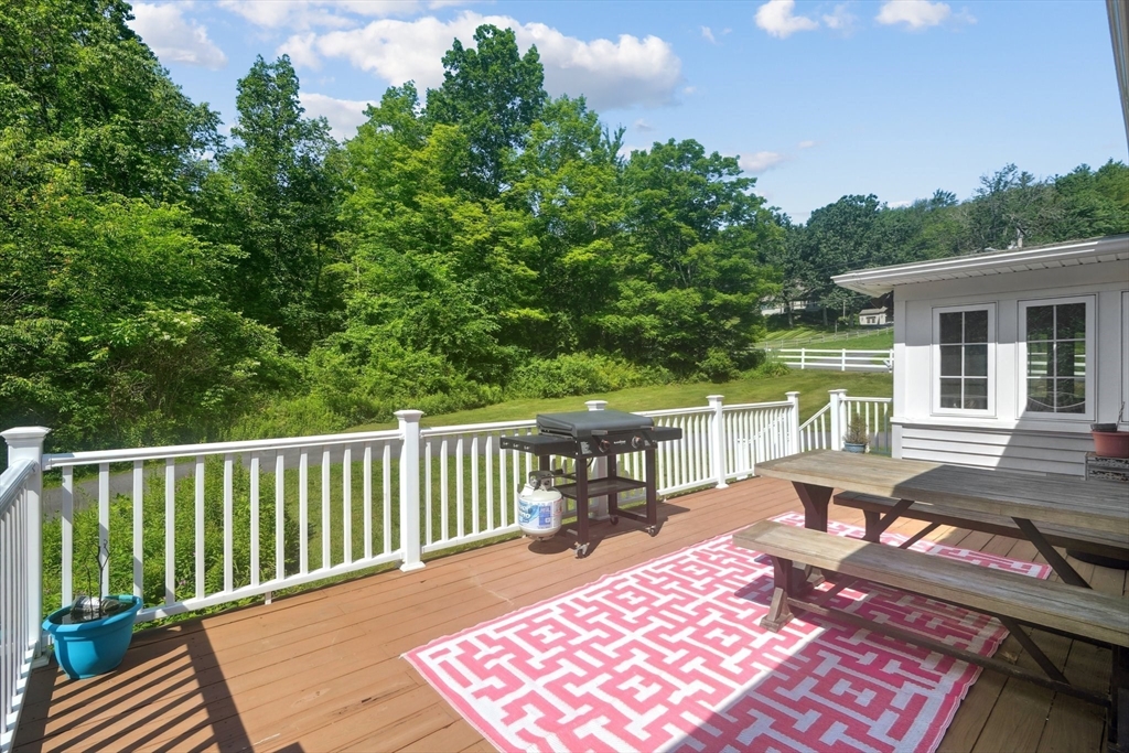156 Langen Road Lancaster, MA 01523 - Photo 20 of 26 a view of a wooden chairs and table in the balcony