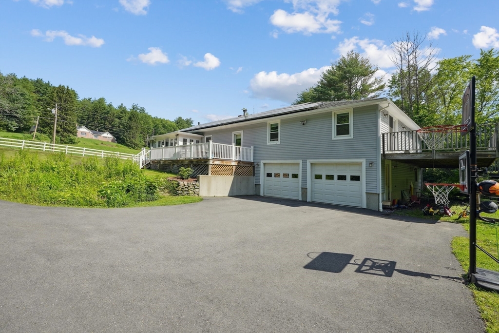 156 Langen Road Lancaster, MA 01523 - Photo 3 of 26 a view of a house with backyard and a tree