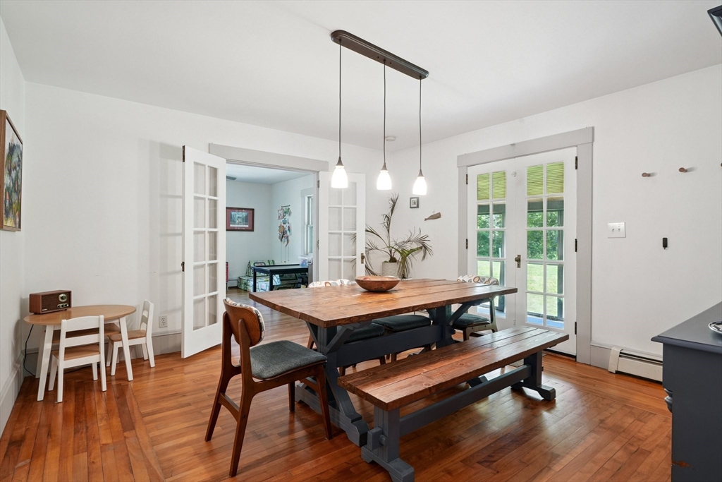 156 Langen Road Lancaster, MA 01523 - Photo 7 of 26 a view of a dining room with furniture window and wooden floor