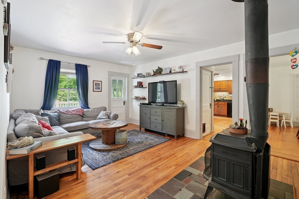 156 Langen Road Lancaster, MA 01523 - Photo 8 of 26 a living room with furniture and wooden floor