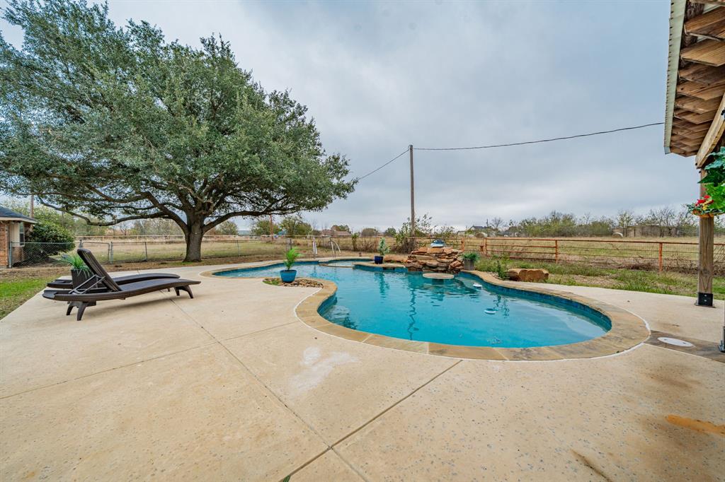 5612 Highway 243 Kaufman, TX 75142 - Photo 28 of 32 swimming pool with outdoor seating and yard