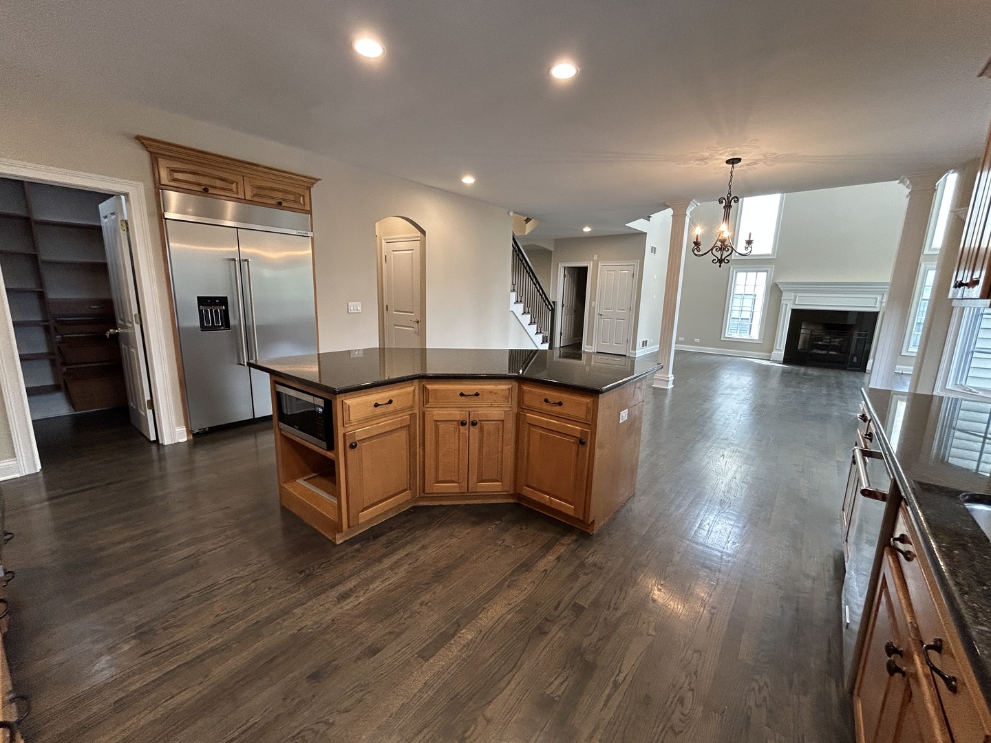 3932 Bluejay Lane Naperville, IL 60564 - Photo 11 of 50 a large kitchen with stainless steel appliances a large counter top and a wooden floors