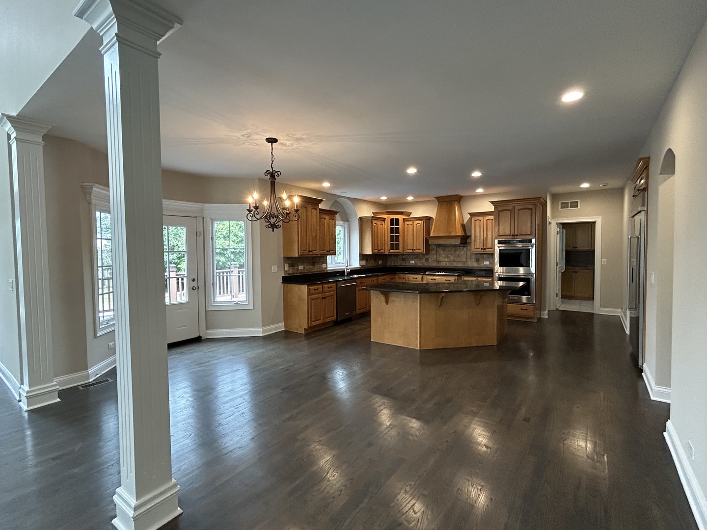 3932 Bluejay Lane Naperville, IL 60564 - Photo 13 of 50 a view of a kitchen with kitchen island and stainless steel appliances