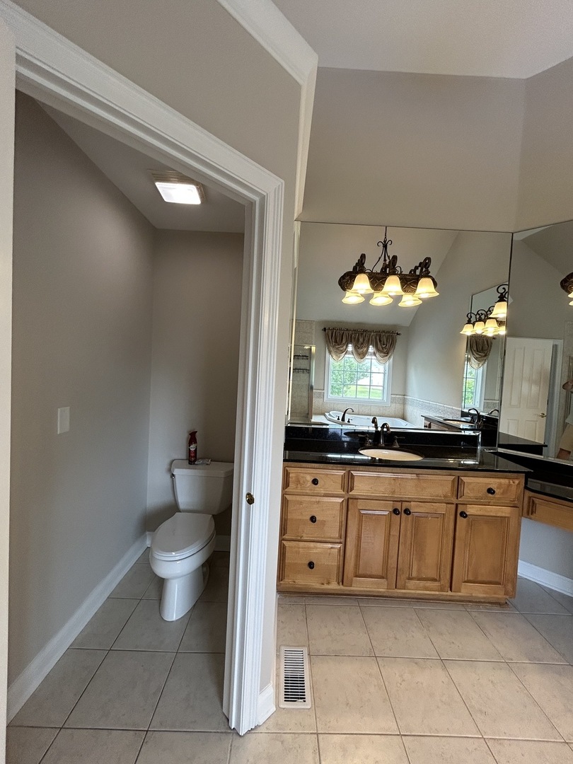 3932 Bluejay Lane Naperville, IL 60564 - Photo 27 of 50 a kitchen with stainless steel appliances a sink and cabinets
