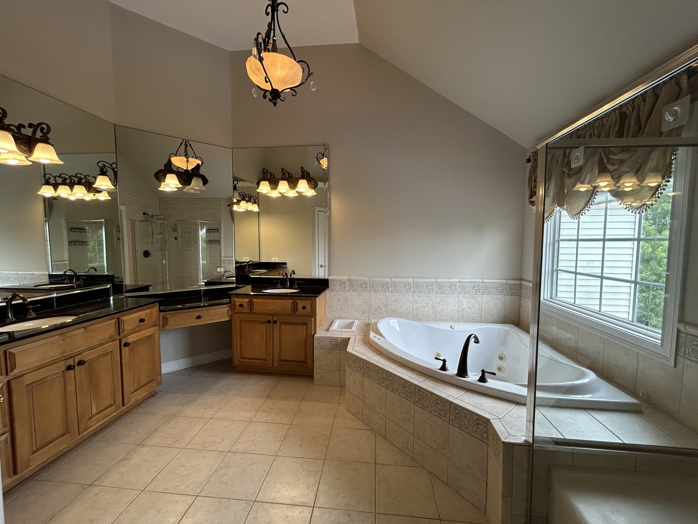 3932 Bluejay Lane Naperville, IL 60564 - Photo 28 of 50 a large kitchen with a large window cabinets and stainless steel appliances