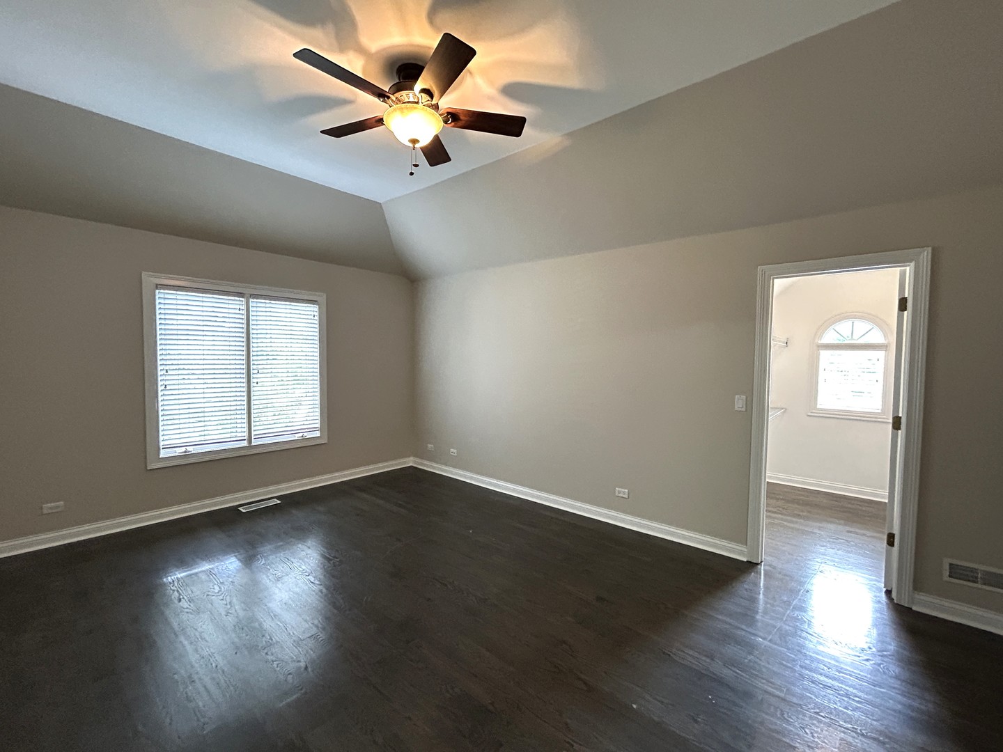 3932 Bluejay Lane Naperville, IL 60564 - Photo 32 of 50 a view of an empty room with wooden floor and a window